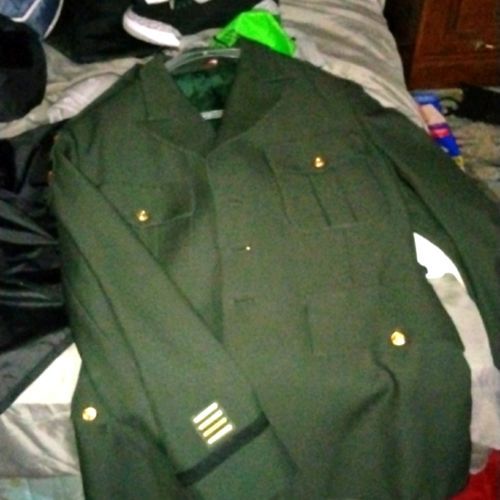 Vintage military style men's jacket with patches and pins